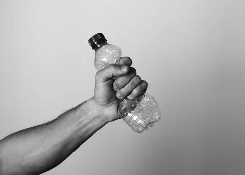 Hand squeezing Plastic Bottle Stock-Fotos