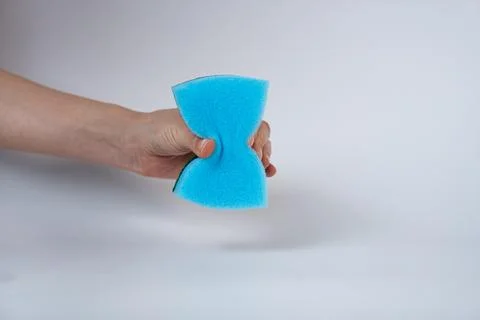 Hand Squeezing Wet Sponge. Cleaning and Hygiene Concept Stock Photos