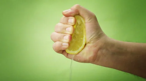 Hand sqweezing lemon Video stock 3592866