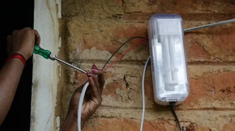 Hand with sr screwdriver and solar light Stock-Footage 60223579