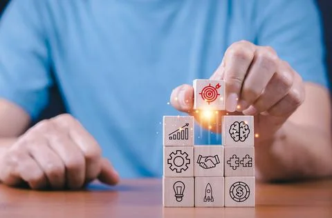 Hand stack woods block step on table with icon Action plan, Goal and target, Stock Photos