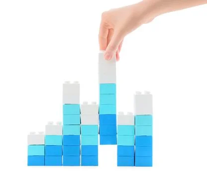Hand stacking blue and white building blocks, growth and development concept, Stock Photos