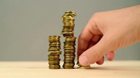 Hand stacking coins. Saving money, manag... | Stock Video | Pond5
