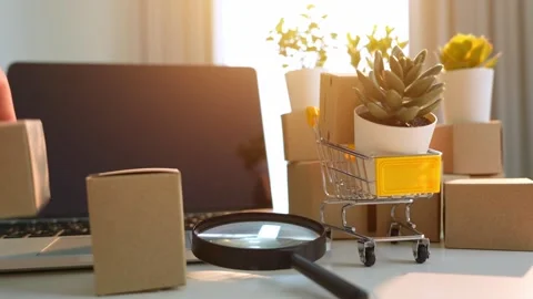 A hand stacks small product boxes. Stock Footage 316141977