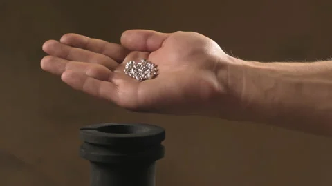 Hand staged throws silver pieces Stock Footage 196174114