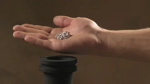 Hand staged throws silver pieces Stock Footage 196174138