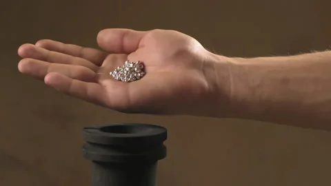 Hand staged throws silver pieces Stock Footage 196174162