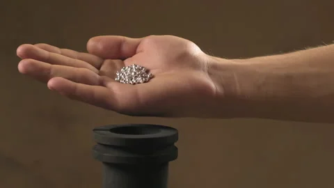 Hand staged throws silver pieces Stock Footage 196174201