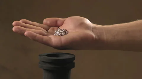 Hand staged throws silver pieces Stock Footage 196174229