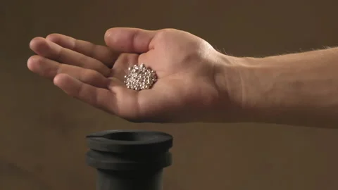 Hand staged throws silver pieces Stock Footage 196174310