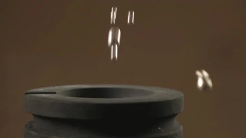 Hand staged throws silver pieces Stock Footage 196174530