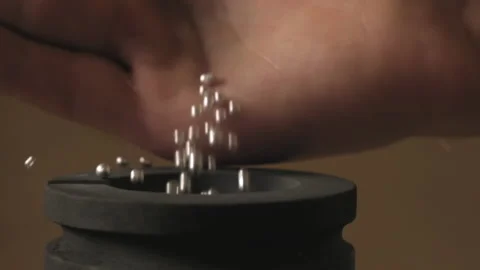 Hand staged throws silver pieces Stock Footage 196174577