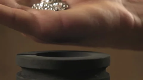 Hand staged throws silver pieces Stock Footage 196174656