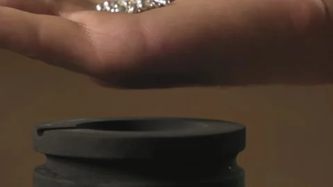 Hand staged throws silver pieces Stock Footage 196174834
