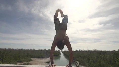 Hand Stand Back Flip Bridge Jump in Slow Motion Stock Footage 87723177