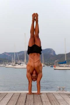 Hand stand man Stock Photos