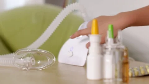 Hand starting and stopping nebuliser inhaler device Stock Footage 80353751