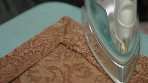 Hand steams fabric custom project Stock Footage 263356510