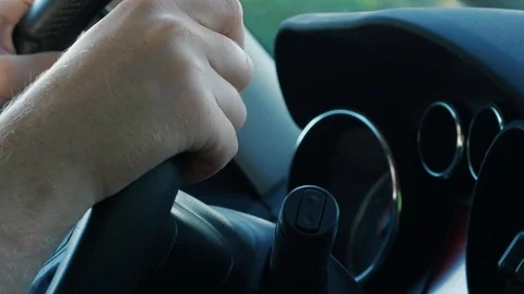 Hand on steering wheel, changer, car dashboard, automobile Stock Footage 109169490