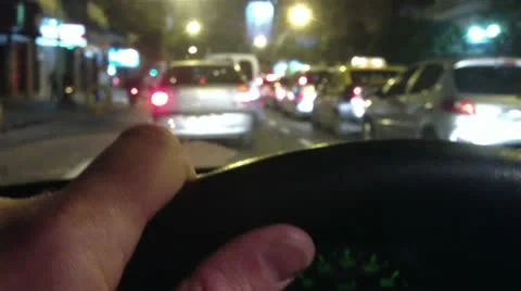 Hand on steering wheel - Night Stock Footage 23975936