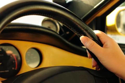 Hand on steering wheel Stock Photos