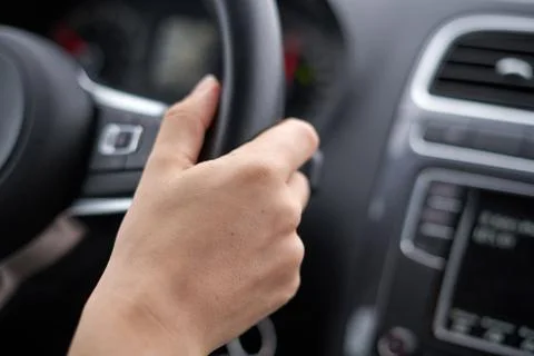 Hand on steering wheel Stock Photos