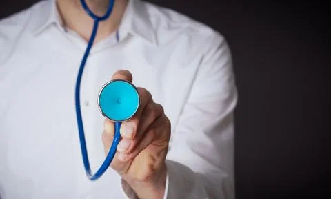 Hand with a stethoscope Stock Photos