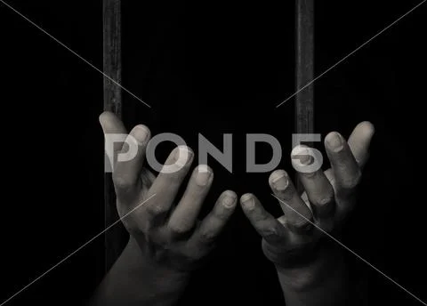 Hand sticking out of a detention attempt. Stock Photos