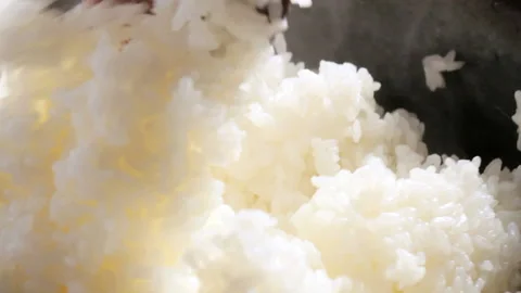 Hand stirring cooked rice Video stock 161798488