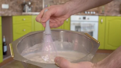 Hand stirring dough with a whisk Stock Footage 128920091