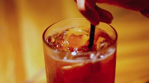 Hand stirring iced tea Stock Footage 329829687