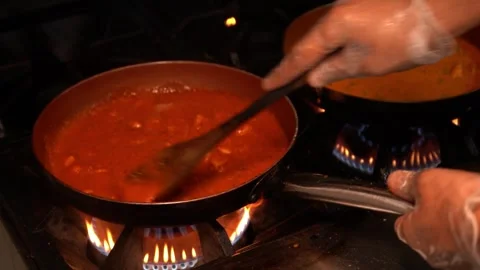 Hand Stirring Sauce in a Pan Stock Footage 318303619