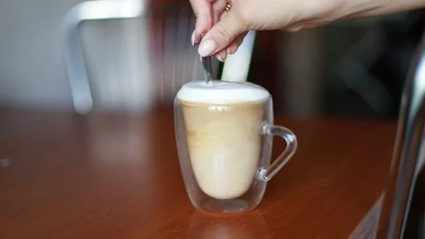 Hand stirs coffee Stock Footage 204014919