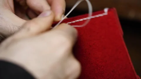 Hand stitching visible seam on leather edge Stock Footage 314961878