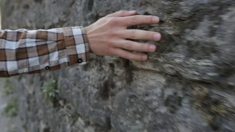 Hand on the stone wall Stock Footage 71014984