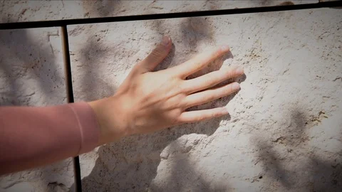 Hand on stone wall texture Stock Footage 89827780