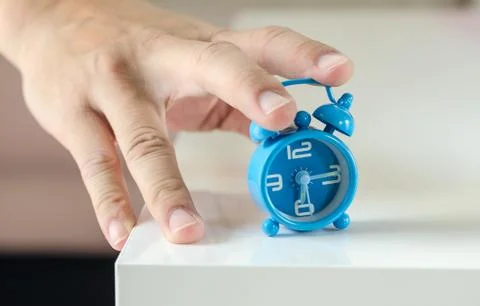 Hand stop the alarm clock Stock Photos