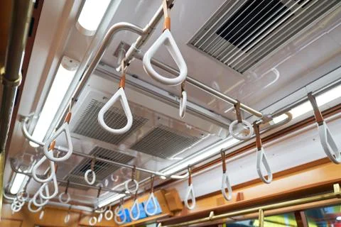 Hand straps in empty tokyo train Stock Photos