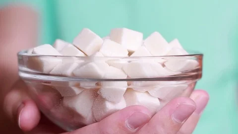 Hand stretching with lump sugar Vídeo Stock 83031162