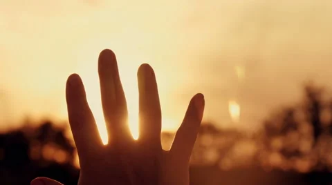 Hand stroking sun stroke sun at sunset Stock-Footage 66239981