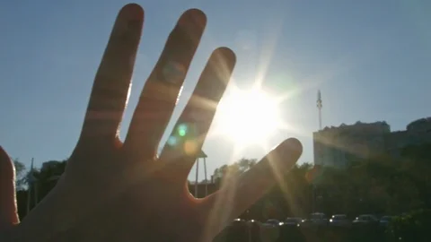 Hand stroking sun at sunset summer evening 4K Raw processed Stock-Footage 89580989