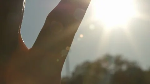 Hand stroking sun at sunset summer evening 4K close up Raw processed Vidéo 89581036
