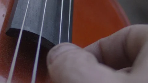 Hand strumming a guitar Stock Footage 127144260