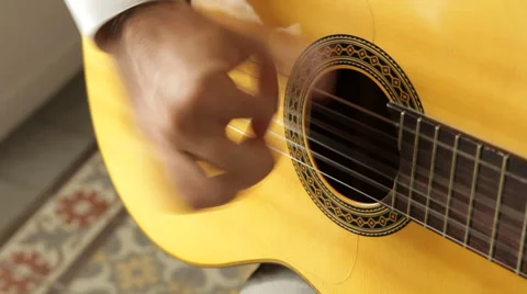 Hand strumming guitar strings Stock Footage 29464738