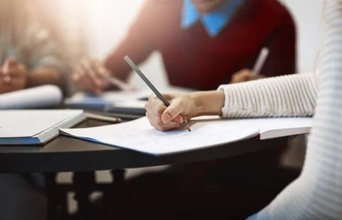 Hand, student and writing notes in university, learning and drawing decision Stock Photos