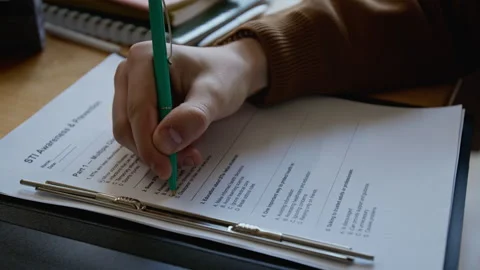 Hand of Student Writing STI Awareness Test at Reproductive Health Course Stock Footage 333728653