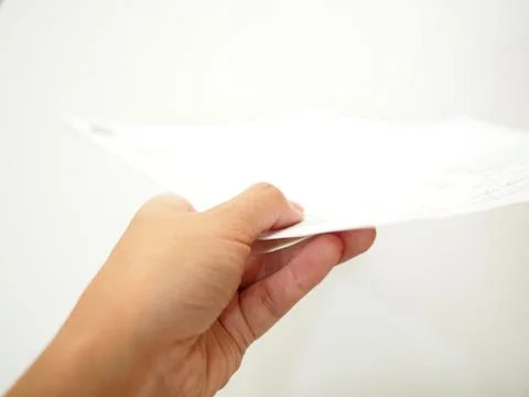 Hand submitting document, white background Foto stock