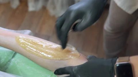 Hand sugaring hair removal method Stock-Footage 147026587