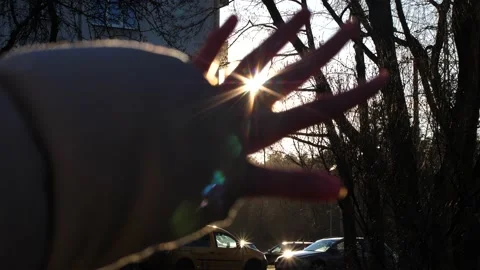 Hand in the sun close-up silhouette sunlight dream of happiness Stock Footage 237454264