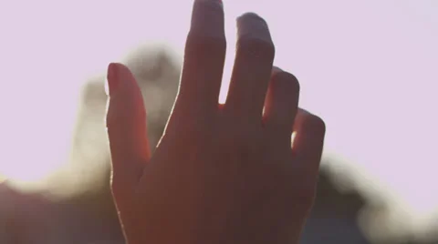 Hand in Sun Rays Stock Footage